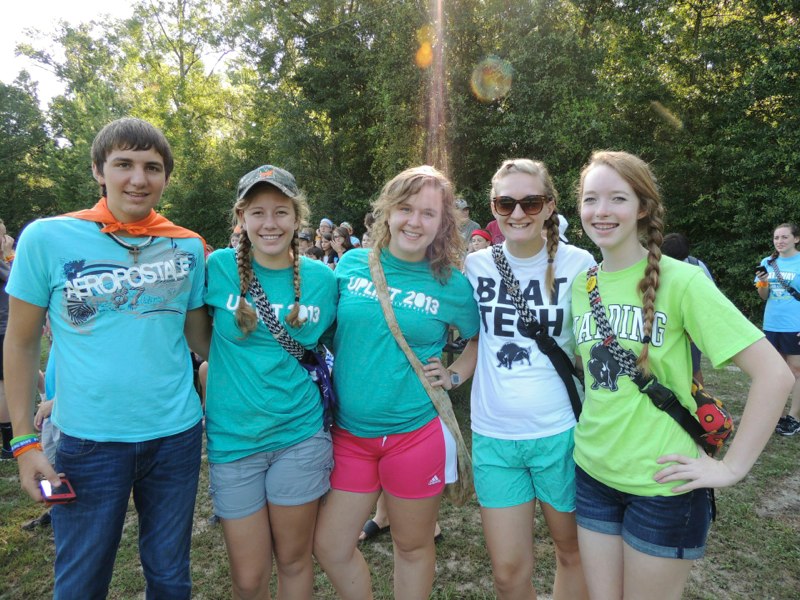 Teen campers posing together outdoors